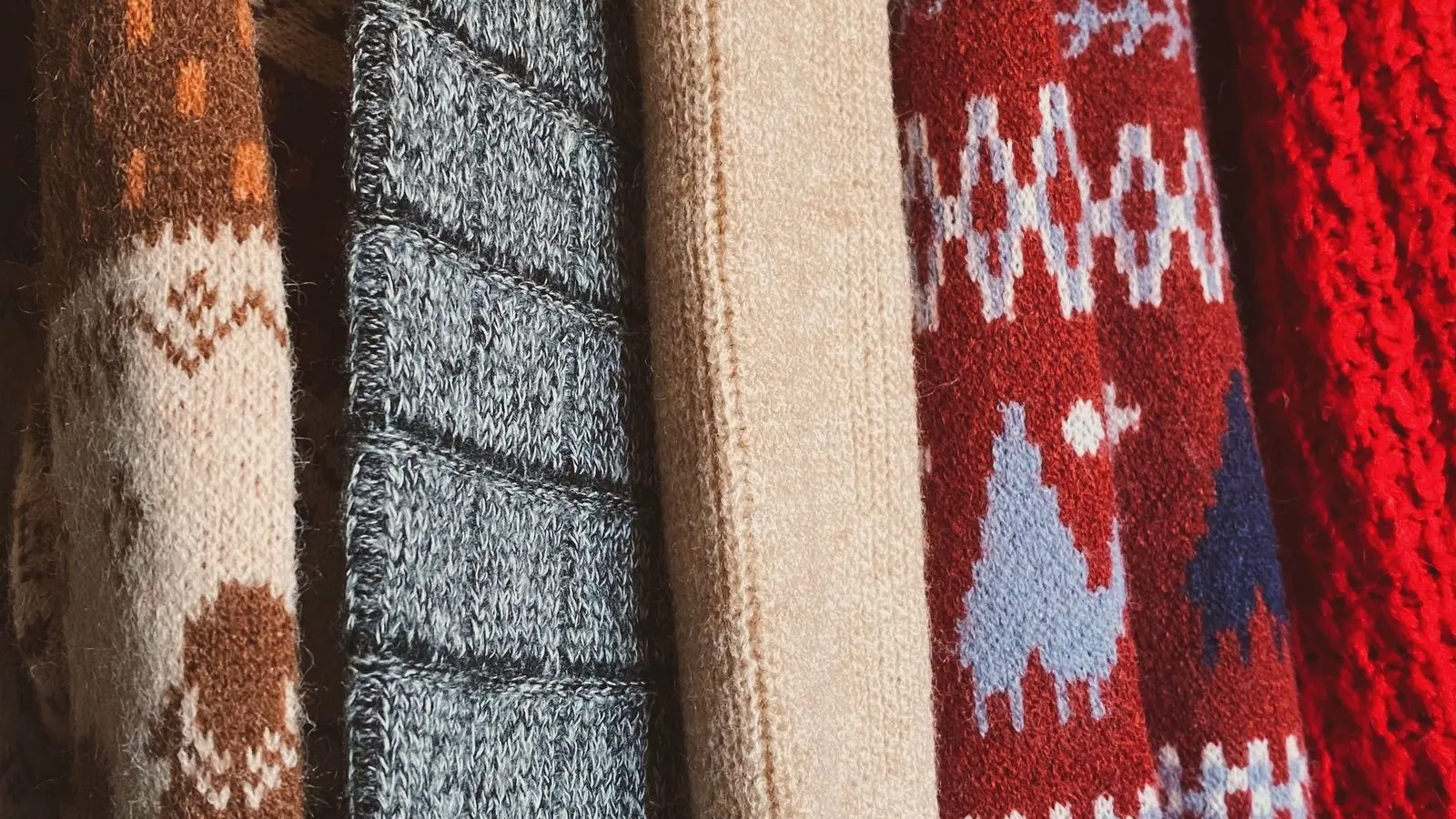 Knitted wool sweater, representing depilling with a sweater comb or fabric shaver.