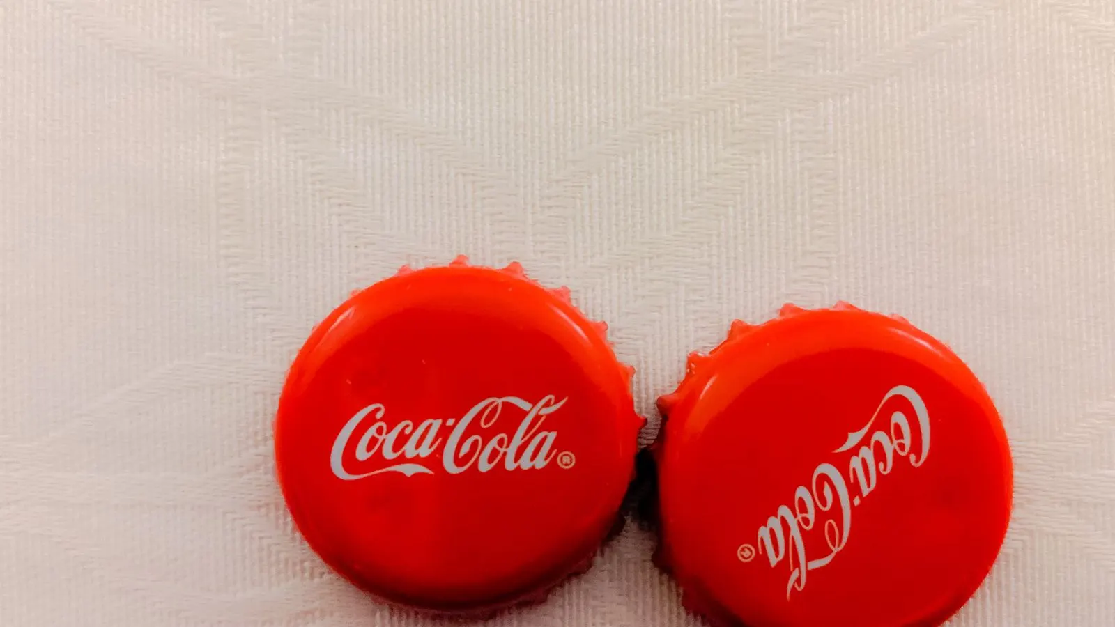 Bottle cap with a printed seal, representing custom printed induction liners.