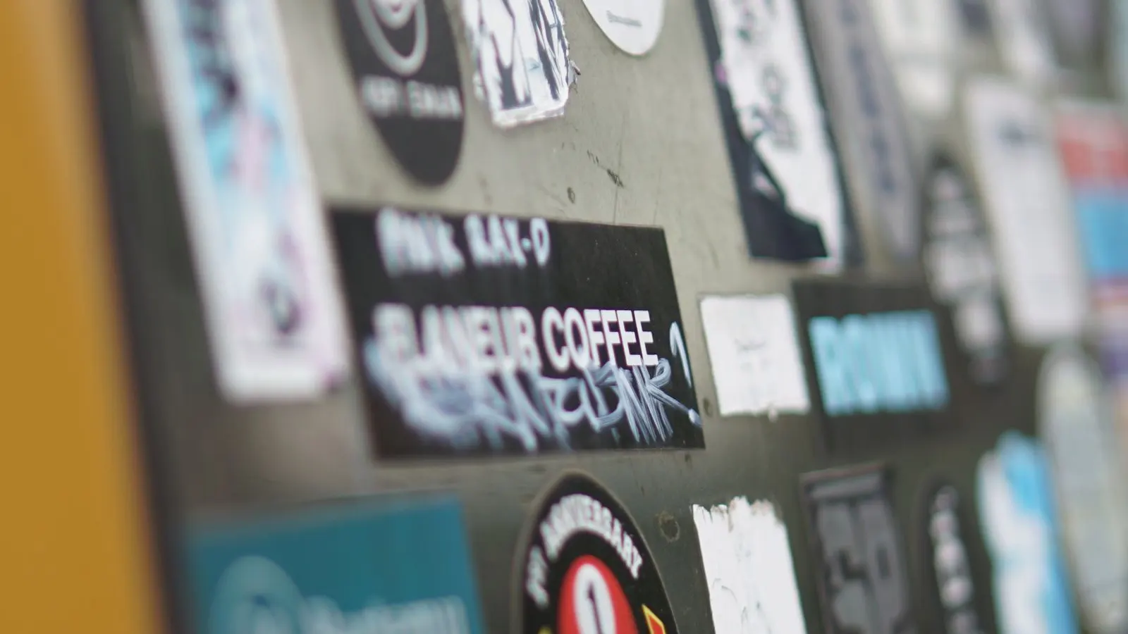 Roll of pressure-sensitive labels, representing pouch label application for coffee bags.