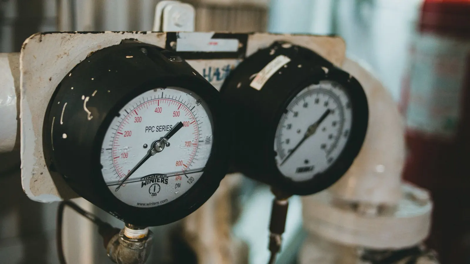 Bottles under quality inspection, representing vacuum chamber leak testing.