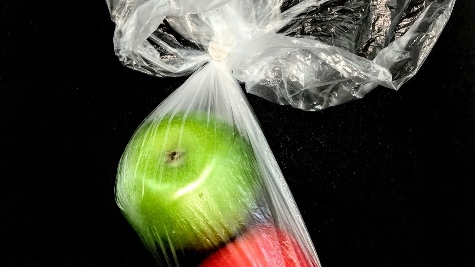 Plastic shrink film in a packaging context, representing film thickness and specification comparison.