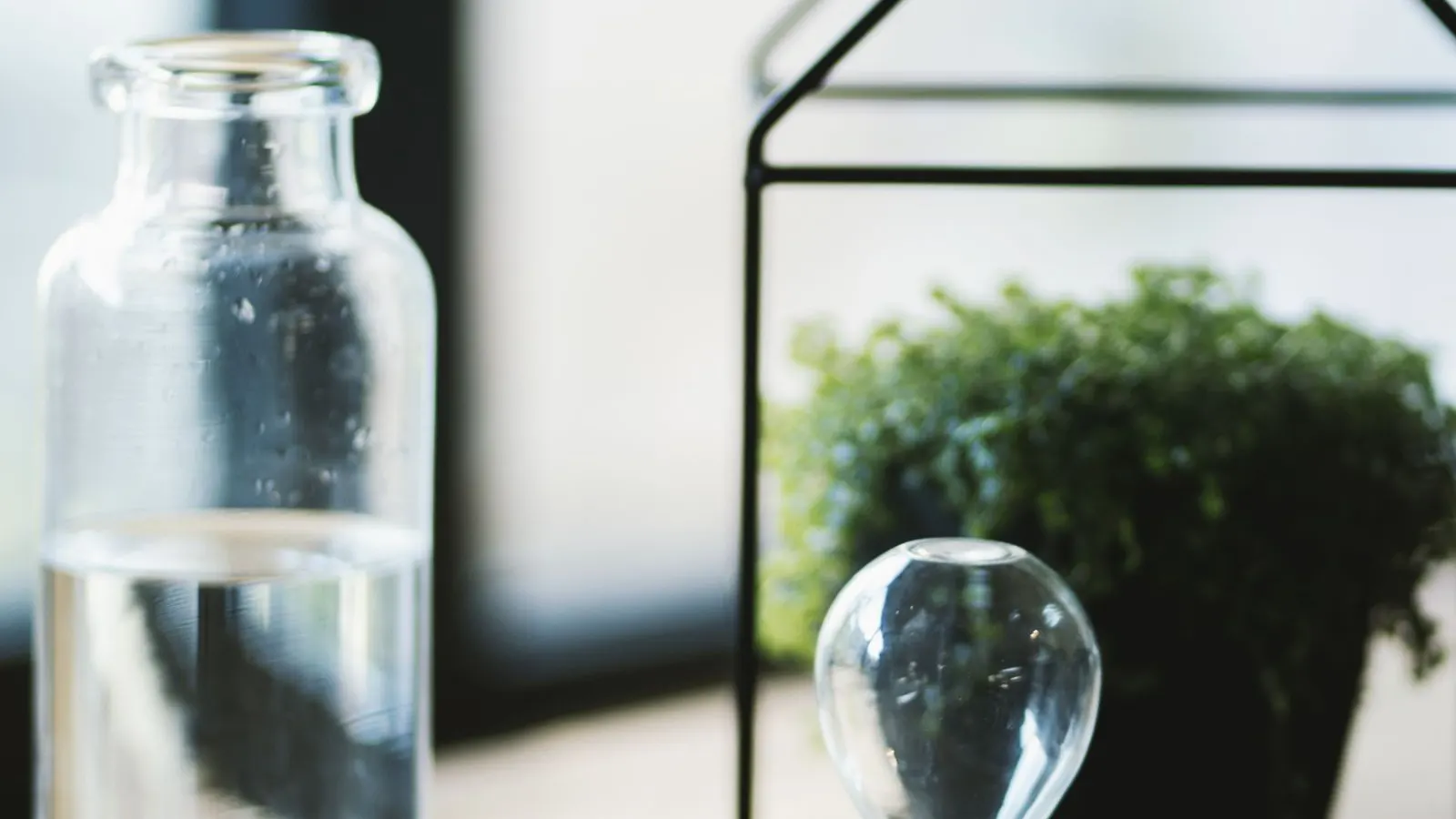 Clear glass bottle, representing induction sealing of glass containers.