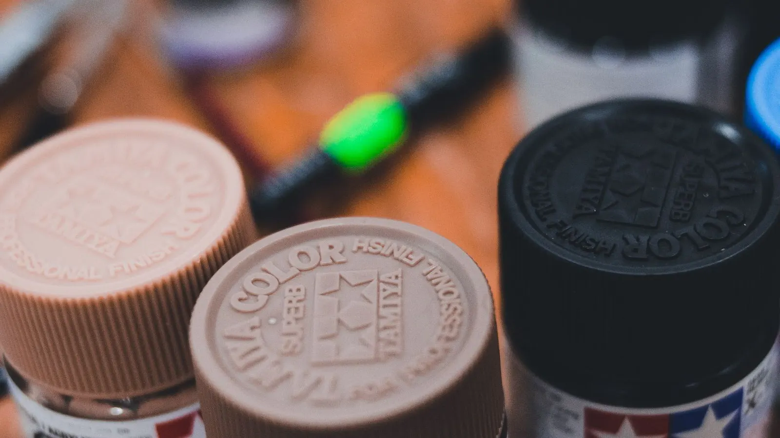 Bottles with caps on a filling line, representing screw cap torque control.
