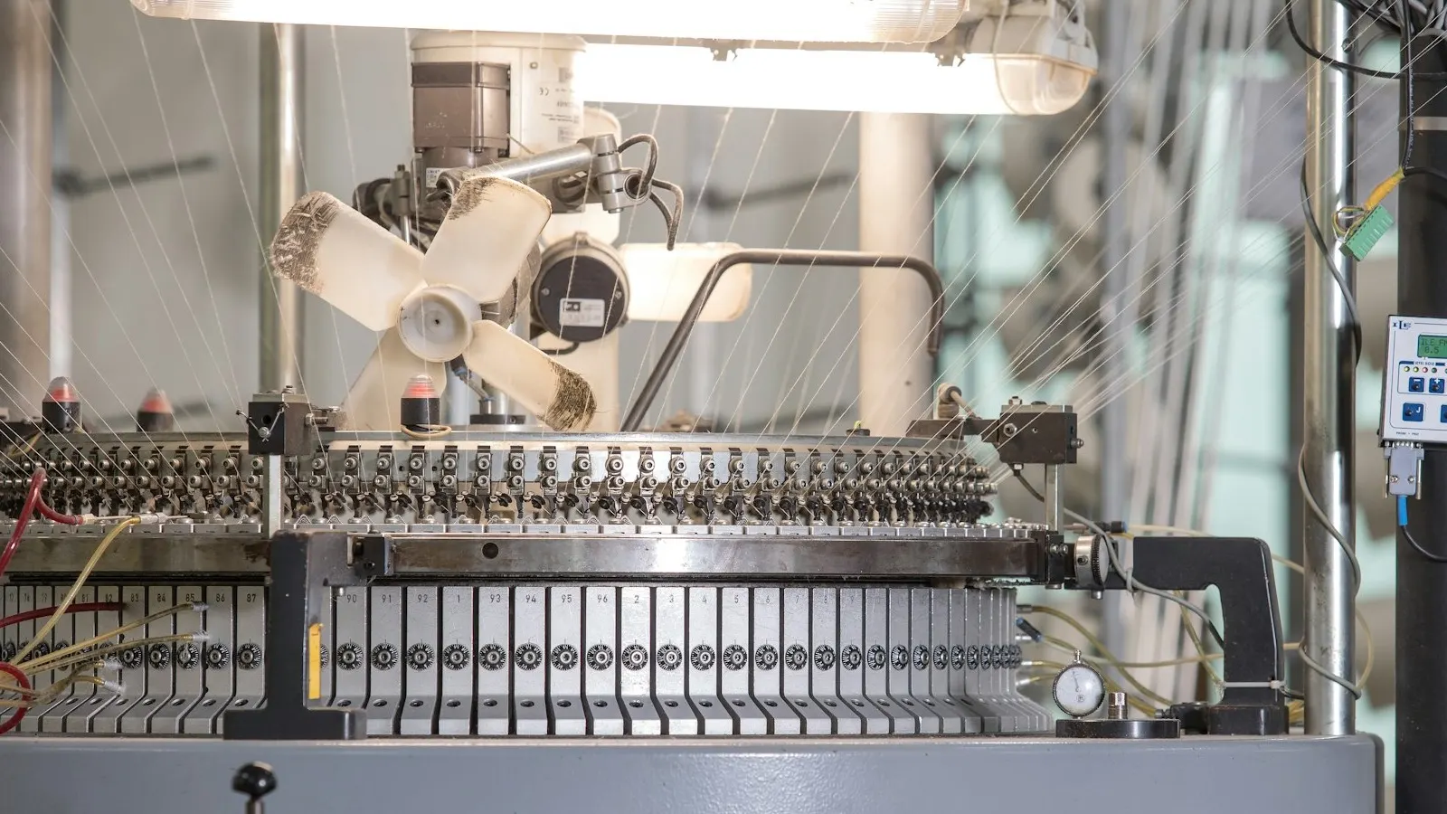 Packaging film rolls and converting equipment, representing shrink-band supply formats.