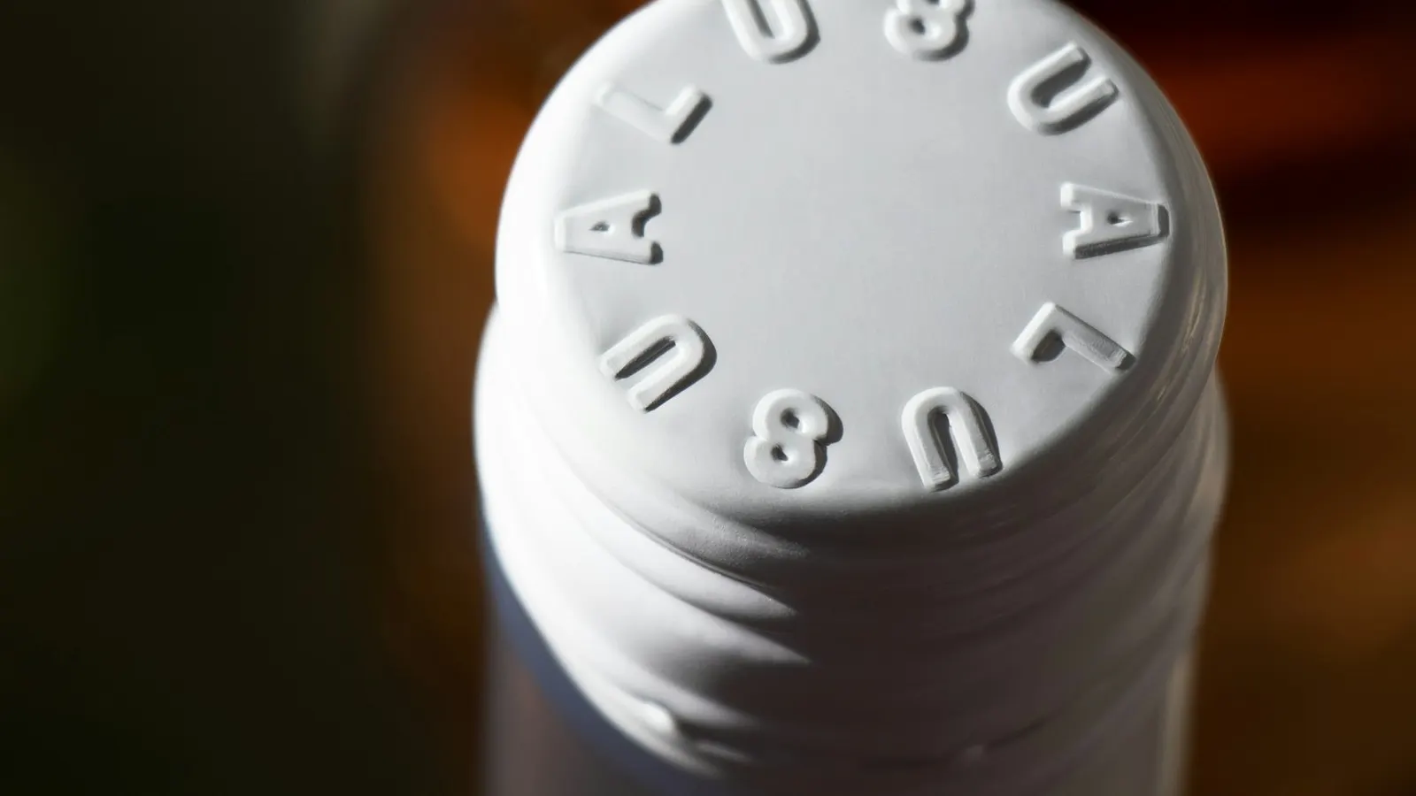 Bottle closure layers and sealing materials, representing one-piece and two-piece induction liner construction.