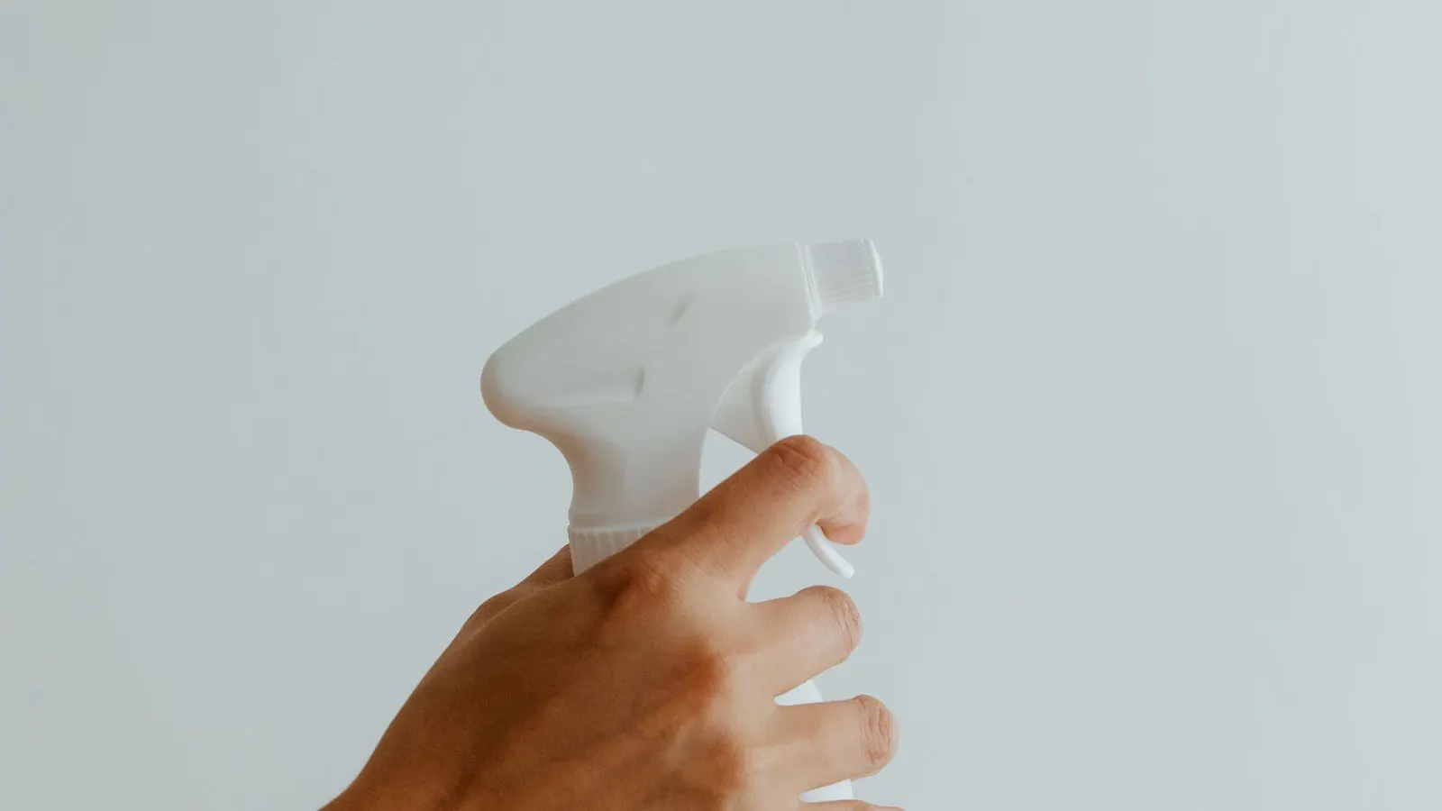 Trigger spray bottle, representing dip-tube length measurement.