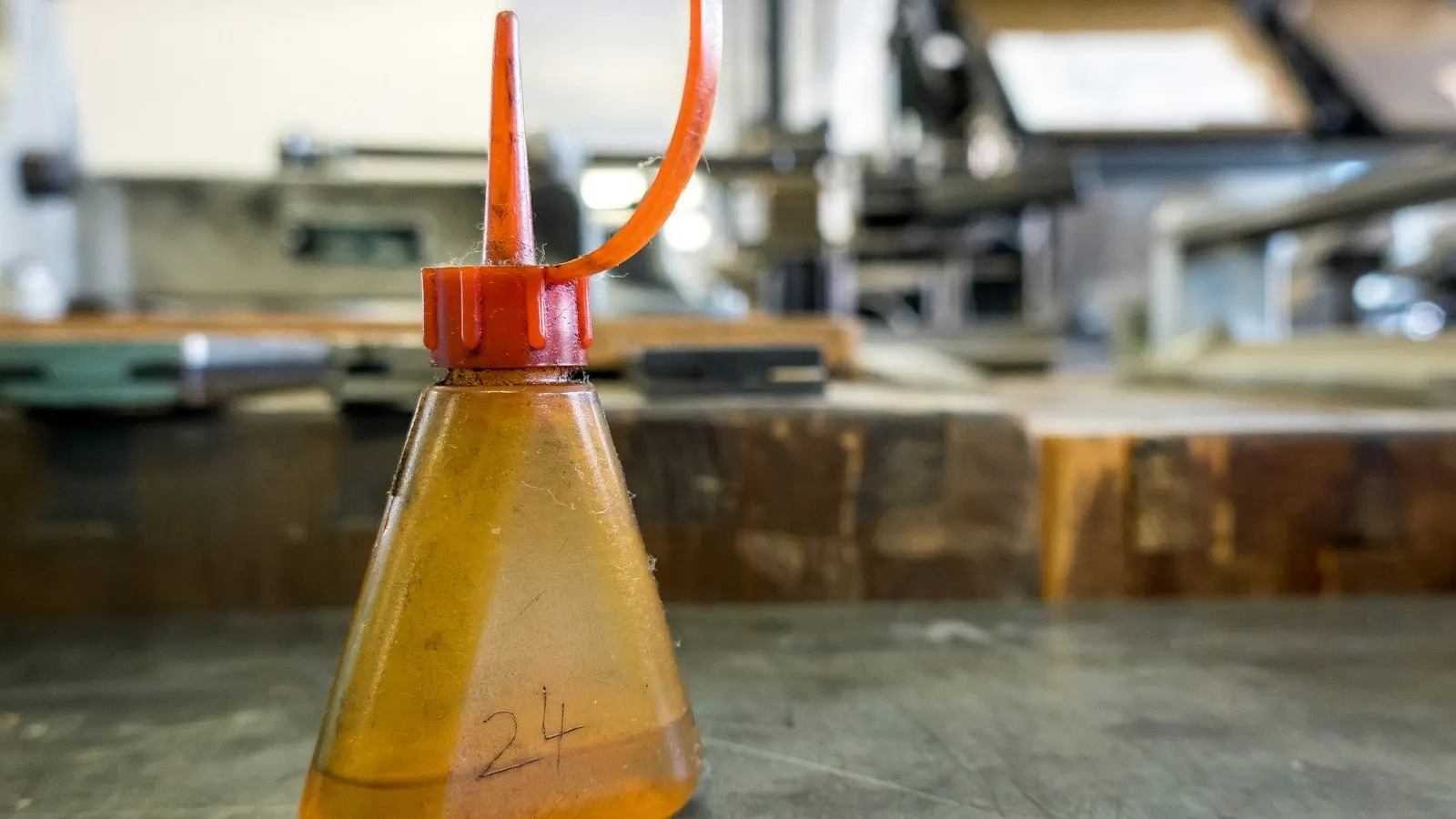 An induction sealing machine on a packaging line, representing seal troubleshooting.
